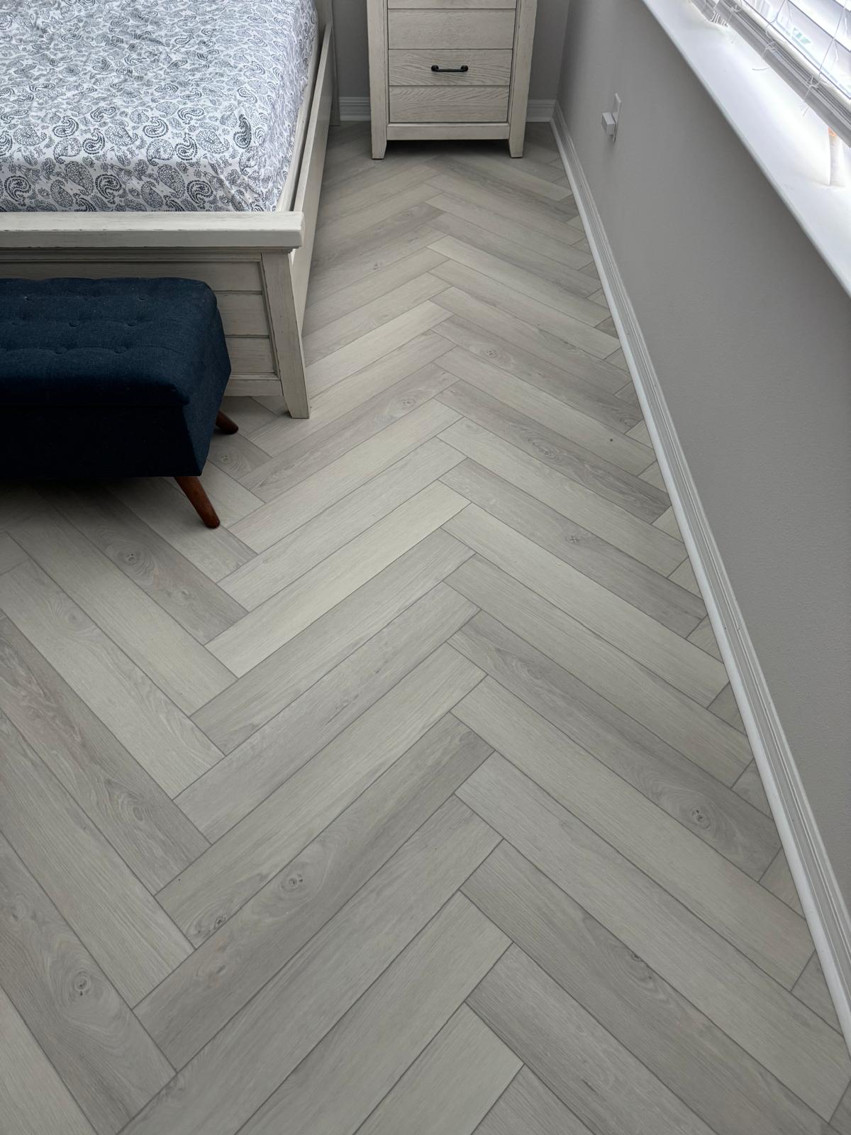Modern laminate wood-look flooring in a bedroom